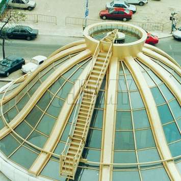 A curved painted JOMY ladder on a dome