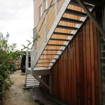 An outside aluminum staircase with clean nice architectural effect